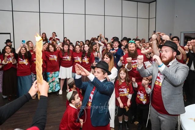 Students and families singing at Havdalah