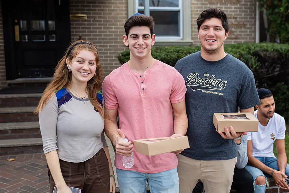 College students together outside a Chabad House