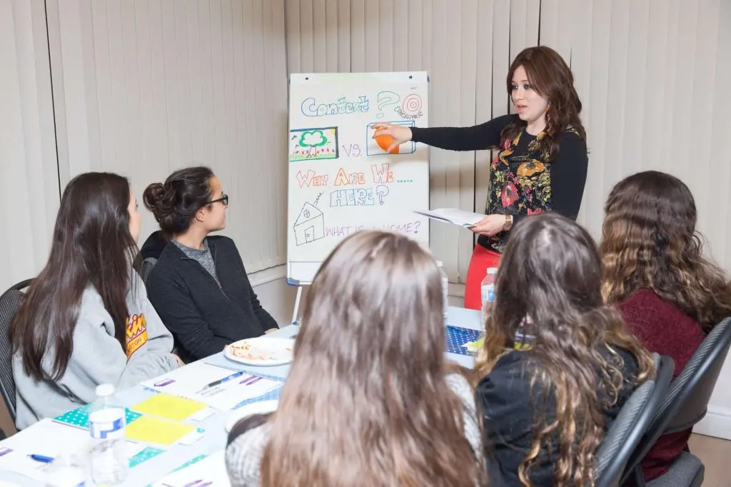 An educator leading a discussion with Jewish college students