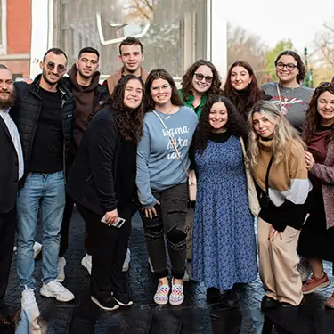 A group of Jewish college students posing together outdoors
